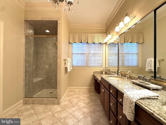 bathroom featuring vanity, crown molding, and a shower with door