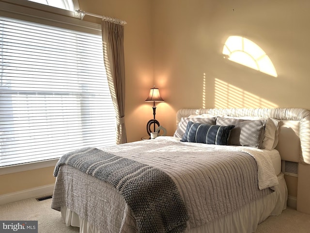 bedroom with light colored carpet