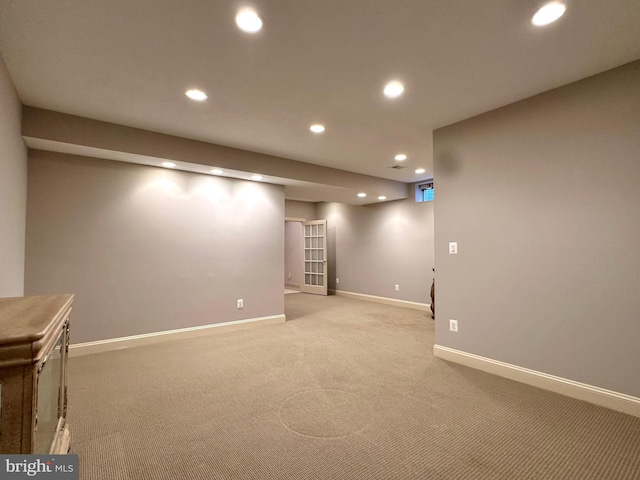 basement with light colored carpet