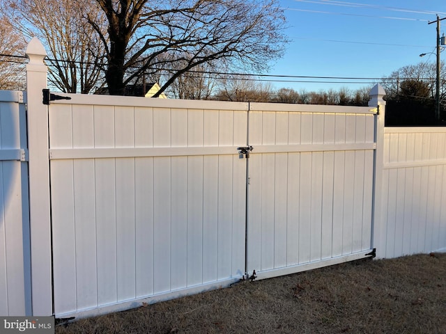 view of gate featuring fence