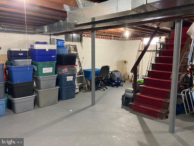 106 Centerton Rd, Bridgeton, NJ 08302 - unfinished basement featuring stairs and concrete block wall