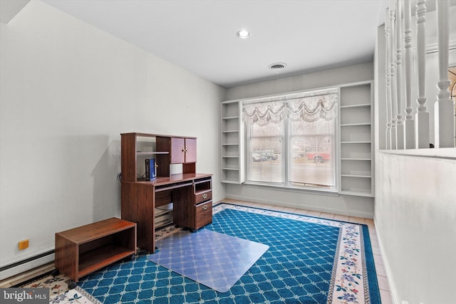 office area with baseboard heating and dark tile patterned flooring