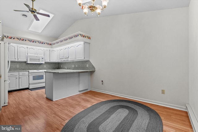 kitchen with kitchen peninsula, white cabinets, white appliances, light hardwood / wood-style floors, and a baseboard heating unit