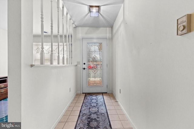 doorway with light tile patterned floors