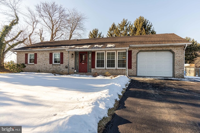 ranch-style home featuring a garage