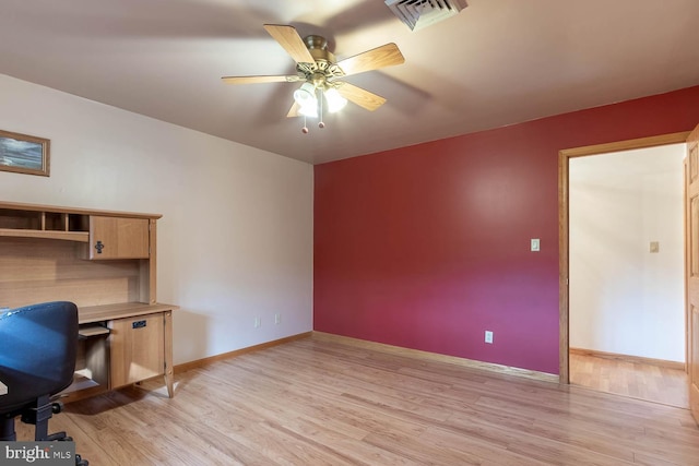 unfurnished office featuring light hardwood / wood-style floors and ceiling fan