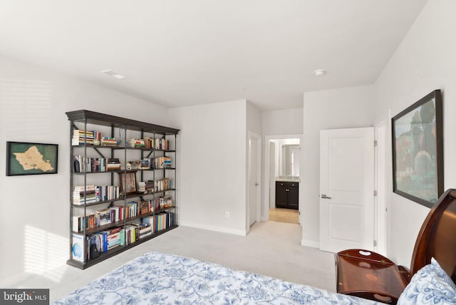 bedroom featuring light carpet