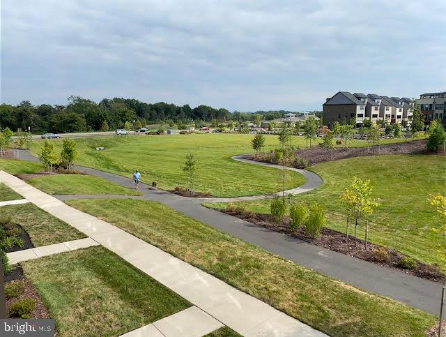 surrounding community featuring a lawn