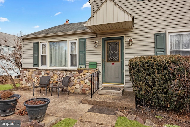 entrance to property with a patio