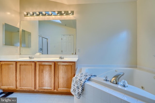 bathroom featuring vanity, shower with separate bathtub, and vaulted ceiling