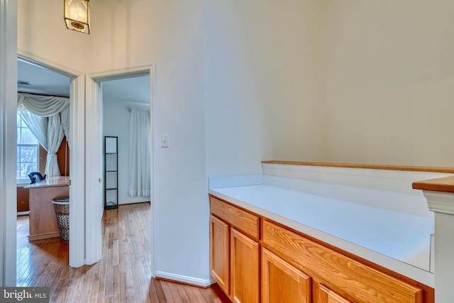 hallway with light wood-type flooring