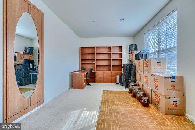 office space with light colored carpet