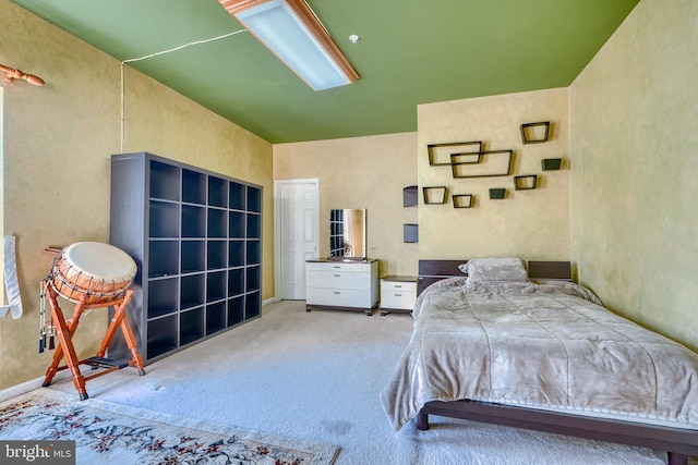 bedroom with light colored carpet