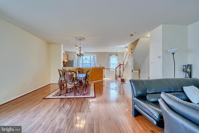 dining room featuring a chandelier and light hardwood / wood-style floors