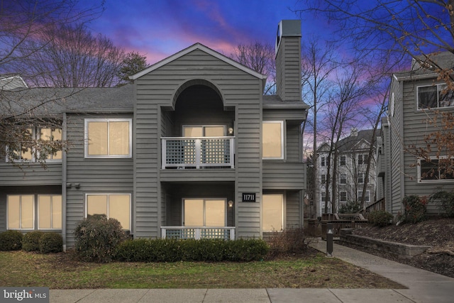 view of front of property with a balcony