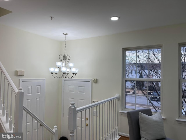 entryway with a notable chandelier