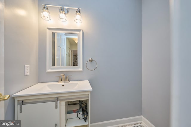 bathroom featuring vanity and baseboards