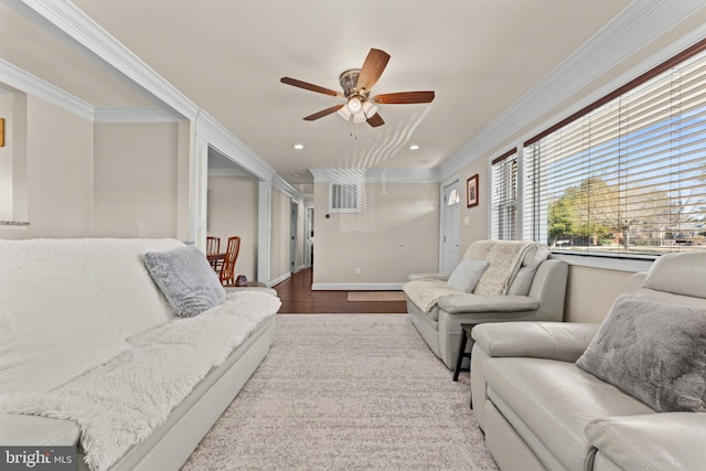 living room with crown molding, recessed lighting, ceiling fan, wood finished floors, and baseboards