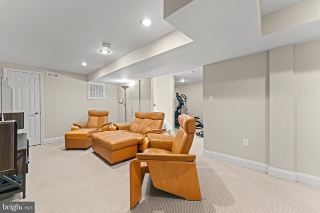 carpeted living area with recessed lighting, visible vents, and baseboards