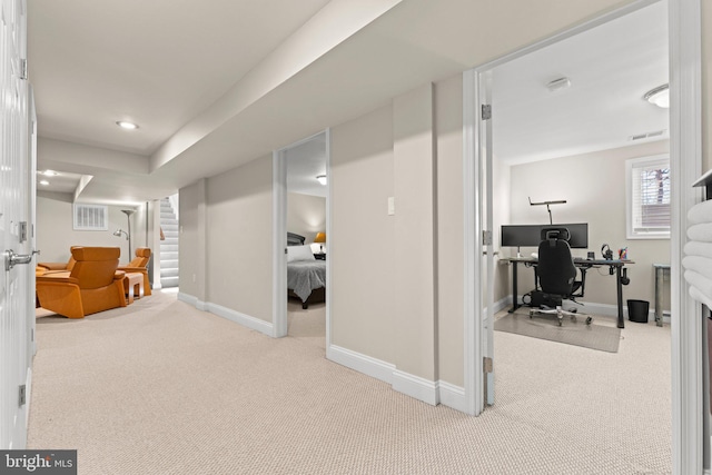 interior space featuring carpet floors, visible vents, stairway, and baseboards