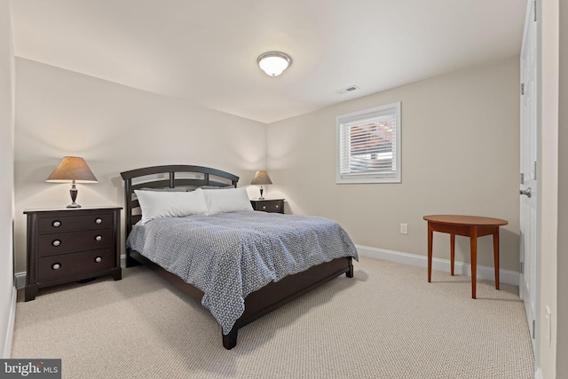 bedroom featuring light carpet, visible vents, and baseboards