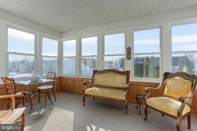 sunroom / solarium with plenty of natural light and wooden ceiling