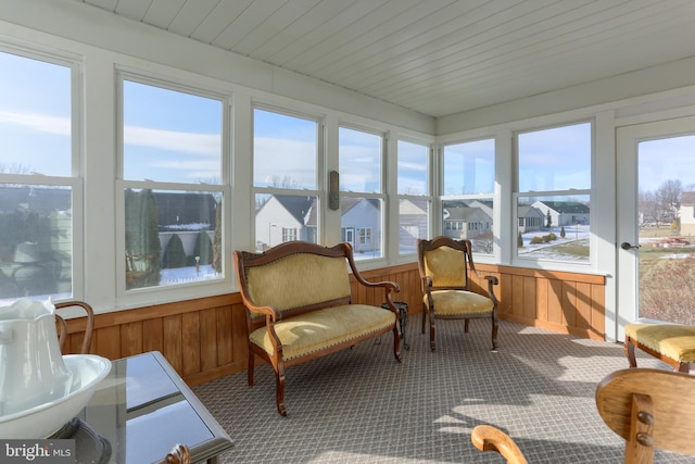 sunroom / solarium featuring wood ceiling