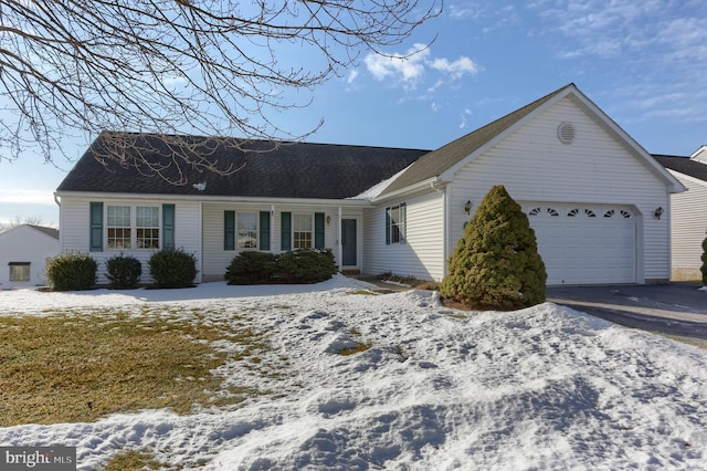 ranch-style house featuring a garage