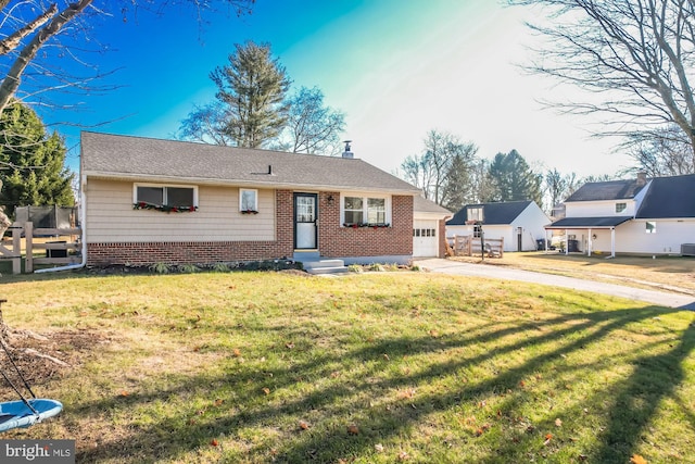 single story home with a garage and a front lawn