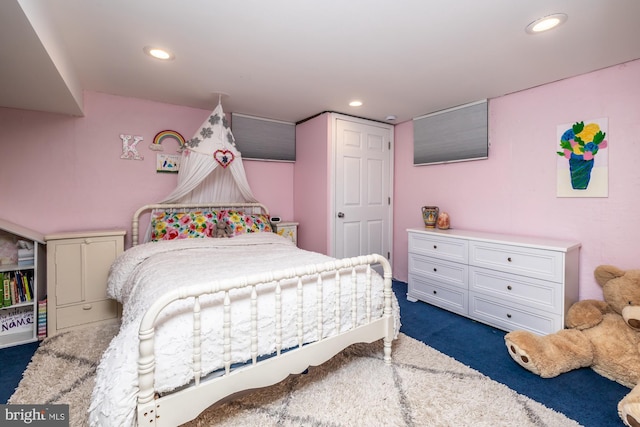 bedroom featuring dark colored carpet