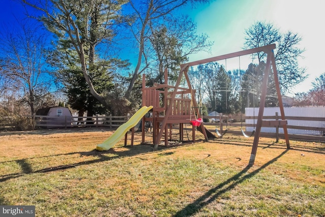 view of jungle gym with a lawn