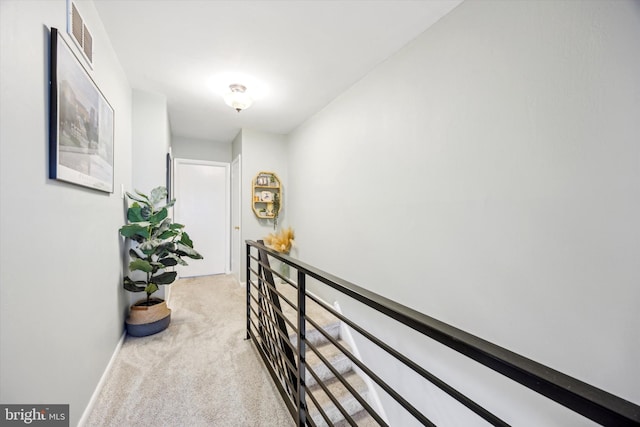 corridor with light colored carpet