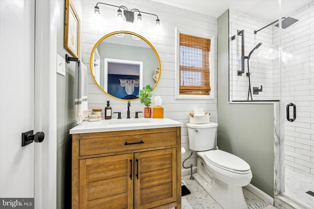 bathroom with vanity, toilet, and a shower with shower door