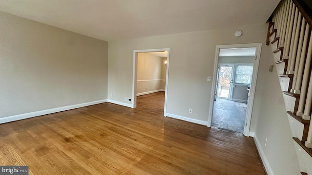 spare room featuring hardwood / wood-style floors