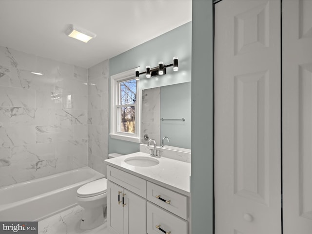 full bathroom featuring tiled shower / bath combo, vanity, and toilet