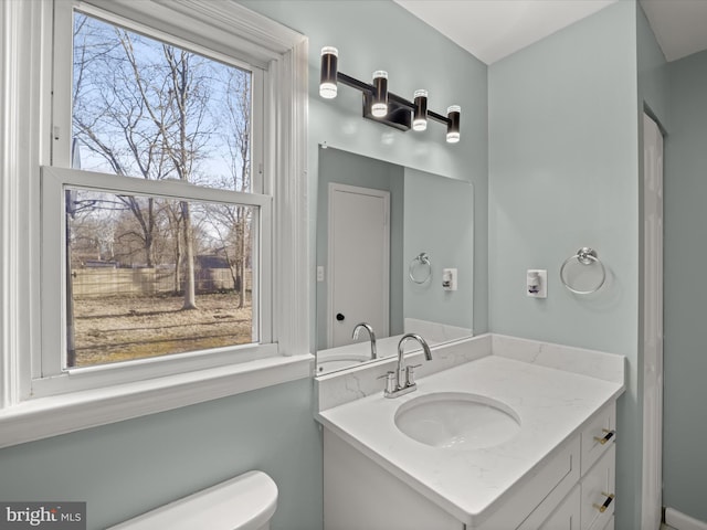 bathroom with vanity and toilet