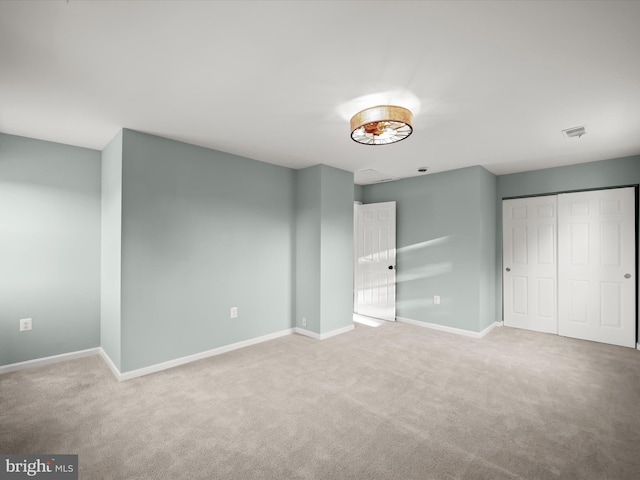 unfurnished bedroom with carpet floors and a closet