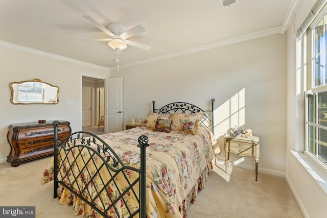 bedroom featuring baseboards, ornamental molding, a ceiling fan, and light colored carpet