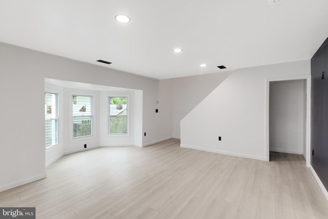 unfurnished living room featuring light wood-type flooring