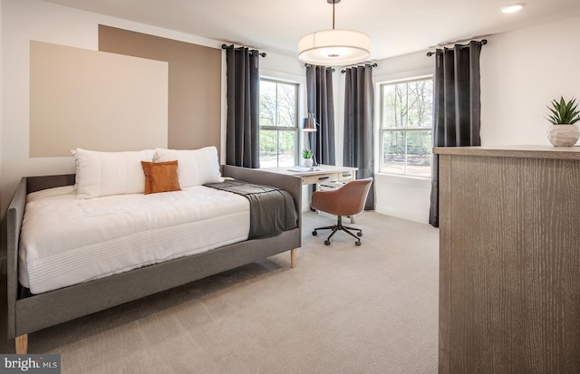 bedroom featuring light colored carpet