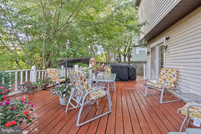 wooden deck with a storage unit