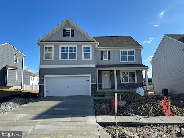 craftsman-style house featuring a garage and covered porch