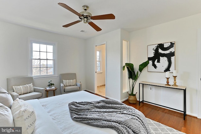 bedroom featuring dark wood-type flooring and ceiling fan