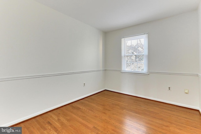 empty room featuring hardwood / wood-style flooring