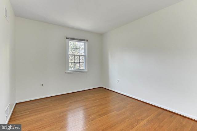 unfurnished room featuring light wood-type flooring