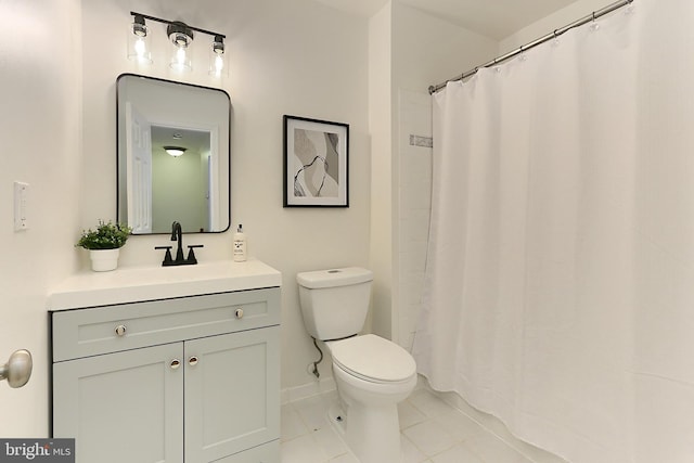 bathroom with vanity, toilet, and tile patterned flooring