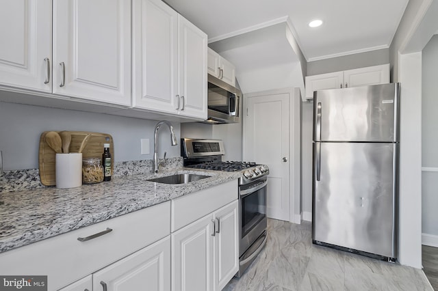 kitchen featuring sink, crown molding, stainless steel appliances, light stone countertops, and white cabinets