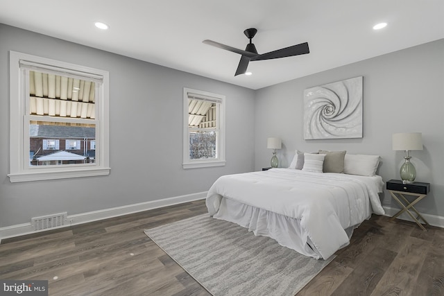 bedroom featuring dark hardwood / wood-style floors and ceiling fan