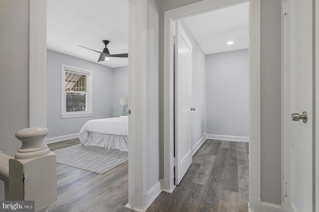 bedroom with dark wood-type flooring and ceiling fan