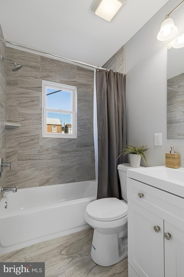 full bathroom featuring vanity, toilet, and shower / bath combo with shower curtain